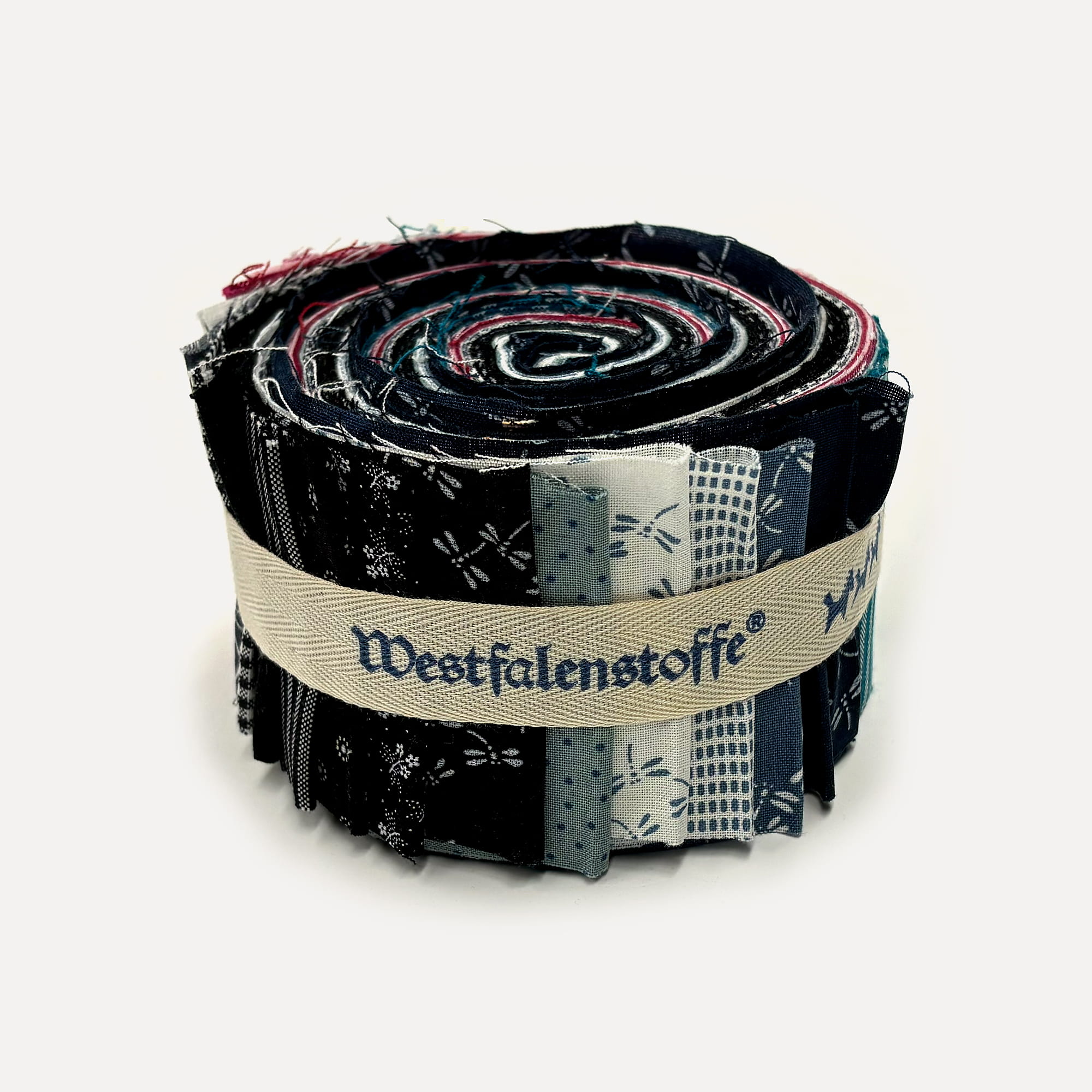 Rolled bundle of patchwork fabric strips in navy, cream, and blue tones bound with a beige ribbon-style band. Close-up of a fabric bolt showing layered quilt-like swatches rolled together and tied with a light beige strap. Assorted fabric samples rolled into a coil, featuring dark and light patterns in blue, black, and red hues. A tightly wound stack of fabric strips forming a circular roll, bound by a woven beige belt with printed text accents. Close-up of a fabric roll used for quilting projects, displaying various printed patterns bound by a neutral strap.