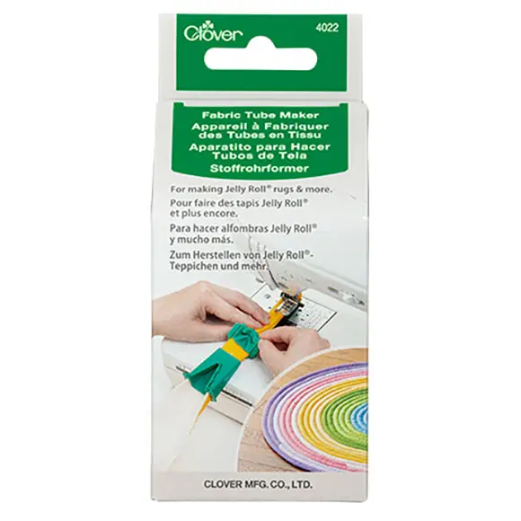 Packaging for Clover Fabric Tube Maker, a tool for making Jelly Roll rugs; shows hands sewing a fabric tube and a rainbow jelly roll.