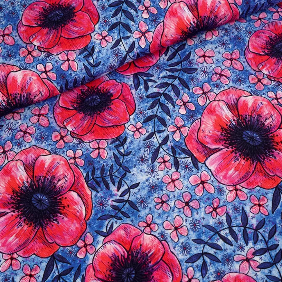 Fabric pattern featuring large red poppies and small pink flowers on a textured blue background with dark leaves.
